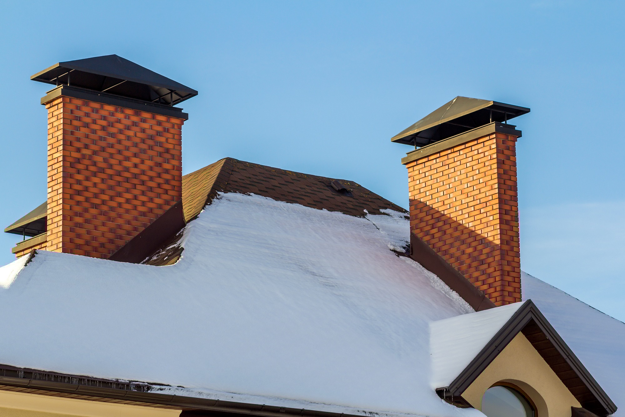 Roof of a new built house with nice window and chimney