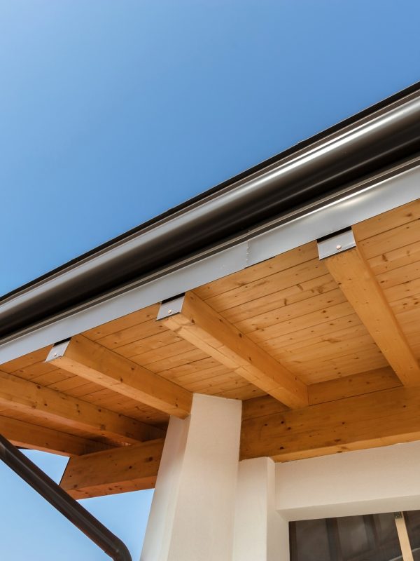 New wooden warm ecological house roof with steel gutter rain system